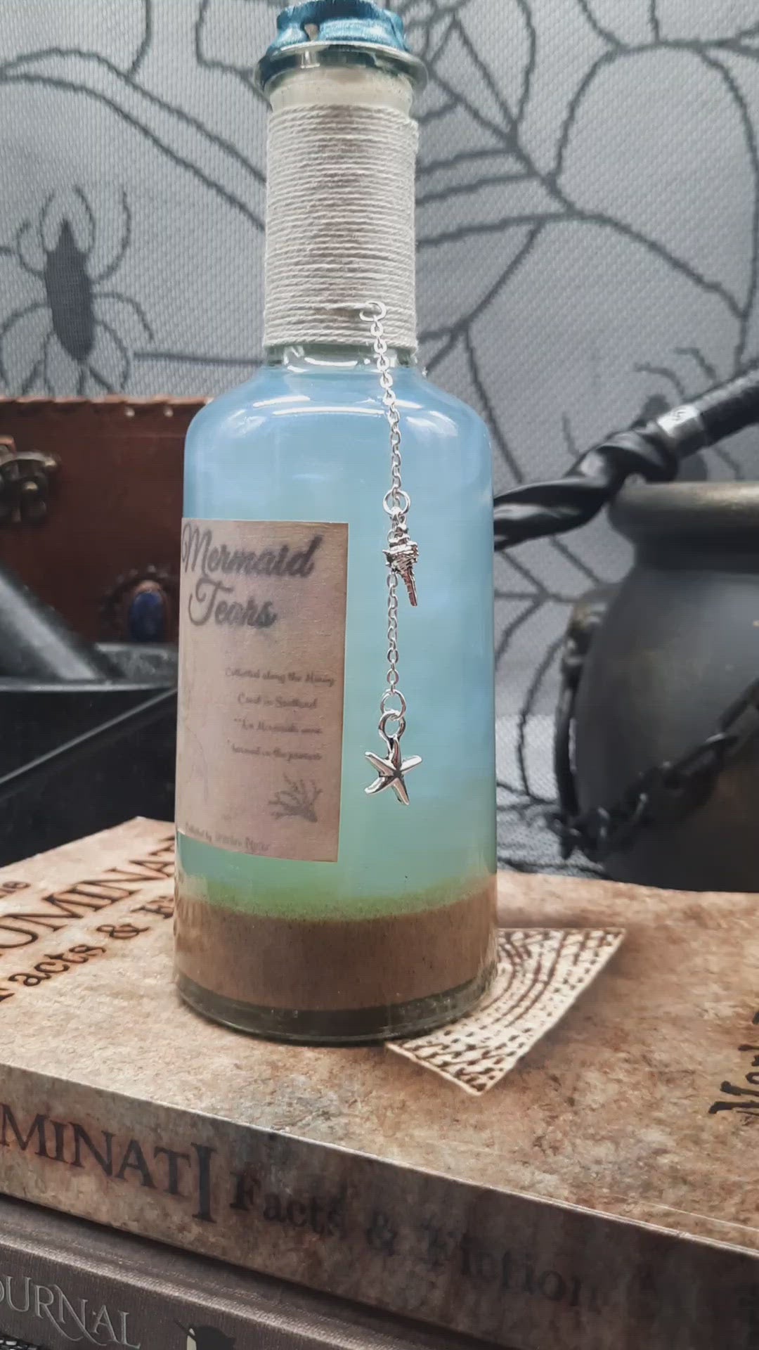 Video showing Mermaid Tears shaken. silvery light blue swirls